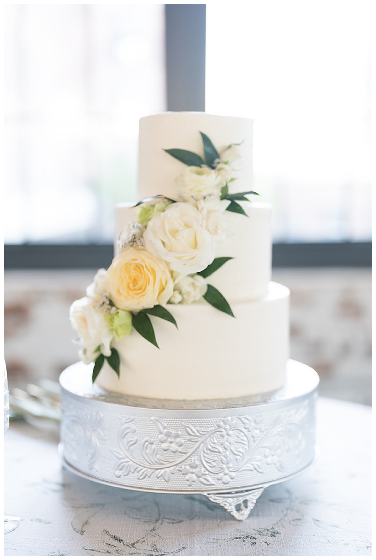 Yellow and White flowers on Wedding Cake